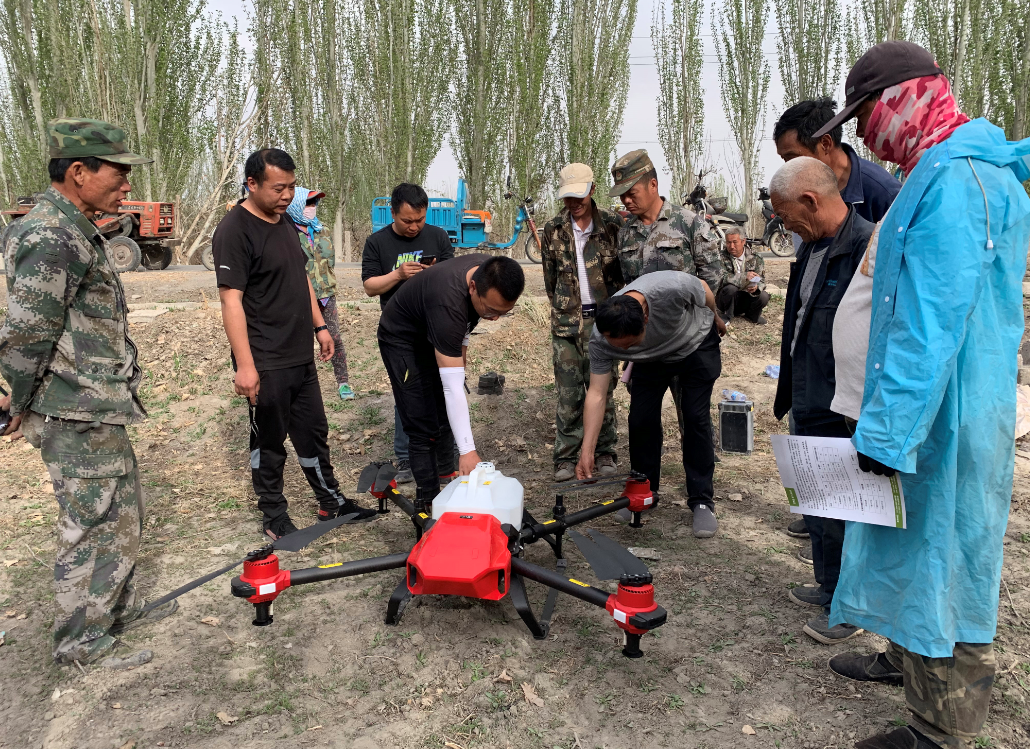 local farmers and operators discussing drone pollination solution