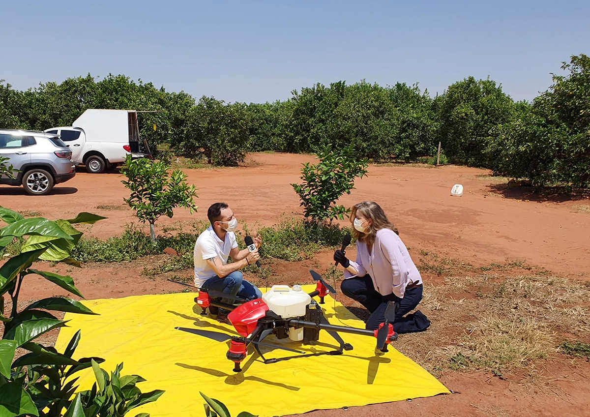 regina being interviewed by local media to introduce the use of drone  combating the notorious cotton weevil