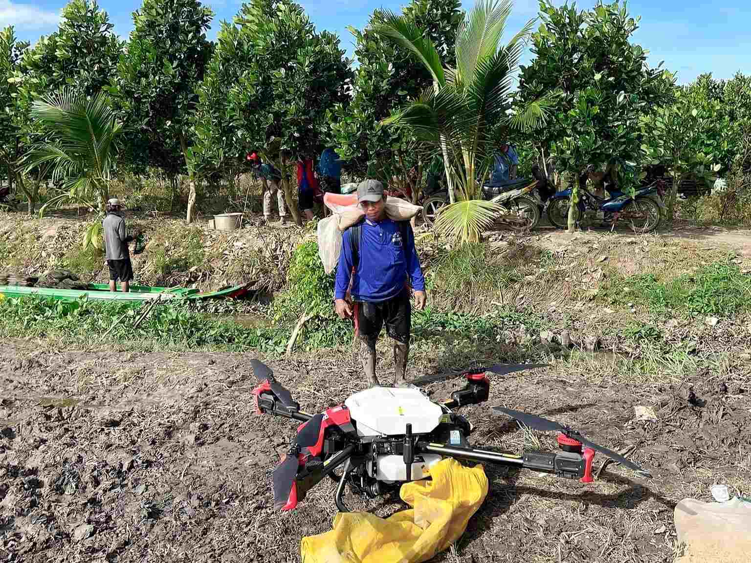 nguyen, a farmer, is quite satisfied with the drone for seeding because of its efficiency